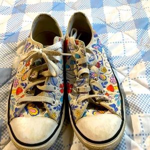 white converse with amazing things all around